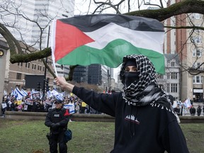 Anti-Israel protesters and pro-Israel supporters hold opposing demonstrations at the McGill University’s campus, in Montreal, Thursday, May 2, 2024.