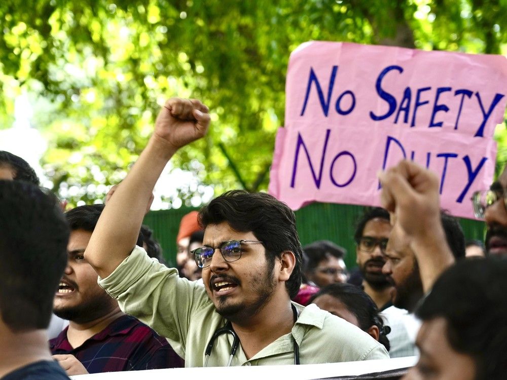 NextImg:Doctors demand tougher laws after a colleague was raped and killed at a hospital in India
