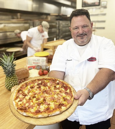 Antonino’s Original Pizza president Joe Ciaravino presents the Angry Hawaiian: ham, double bacon, pineapple and hot peppers.