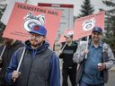 Teamsters Canada Rail Conference members walk a picket line at the CPKC headquarters in Calgary on Thursday, Aug. 22, 2024.