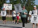 Striking Canadian National Railway workers are seen on Dougal Avenue in Windsor on Thursday, August 22, 2024.