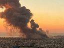 Smoke rises above Beirut's southern suburbs during an Israeli strike on Sept. 27, 2024. Hezbollah leader Hassan Nasrallah was killed in an airstrike.