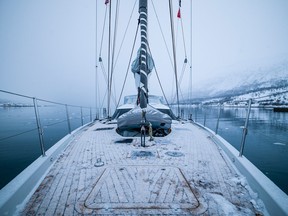 The deck of a yacht covered with light snow.
