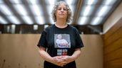 Former Hamas hostage Aviva Siegel poses with a t-shirt showing a picture of her husband Keith Siegel during an interview with AFP during her visit to the 55th session of the UN Human Rights Council in Geneva on February 28, 2024. Aviva Siegel was released on November 26, 2023, her husband is still being held hostage.