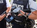 Const. Luke Frampton of Wood Buffalo RCMP holds a drone outside the Timberlea detachment on July 16, 2024.