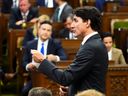 Opposition Leader Pierre Poilievre listens to Prime Minister Justin Trudeau speak on the second-last day of the spring session in Parliament, June 18, 2024.