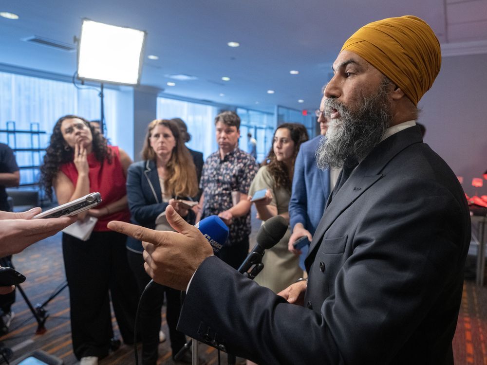 NextImg:Singh hints NDP will scrap its support for Liberal carbon tax: 'We’ve been working on a plan'