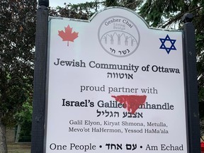 A vandalized sign.
