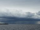 A thunderstorm can be seen moving over Tampa, Florida in the distance ahead of Hurricane Milton's expected landfall in the middle of this week on October 8, 2024.
