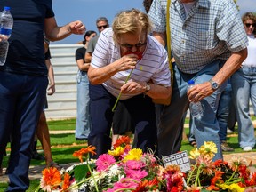 Woman smells flowers