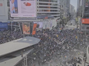 Screenshot from a video by Toronto man Jon Fraser showing a crowd in Yonge and Dundas Square chanting for