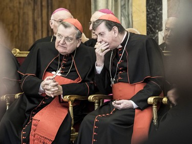 Former archbishop of St. Louis Cardinal Raymond Burke, left, at the Clementina Hall on Dec. 22, 2016, in Vatican City.