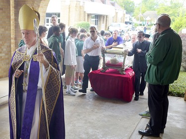 Bishop Joseph Strickland walks in front of a reliquary bearing the bones of Saint Maria Goretti at Cathedral of the Immaculate Conception in Tyler, Texas, in November 2015.