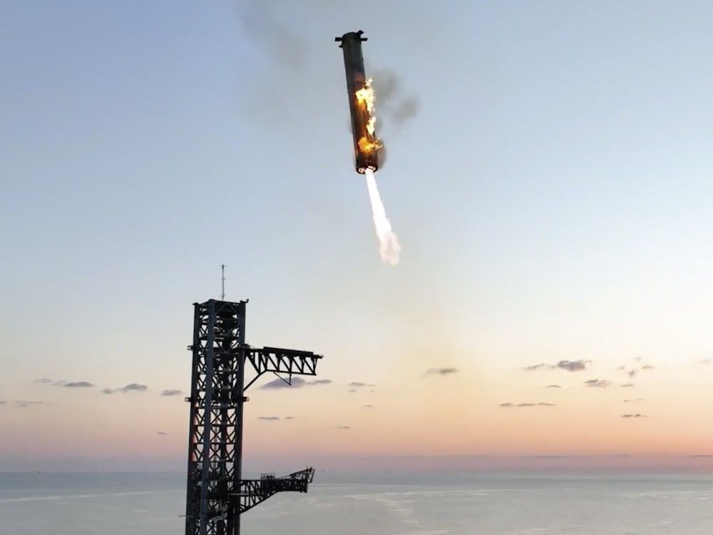 NextImg:Footage shows SpaceX arms catch Starship rocket booster back at the launch pad