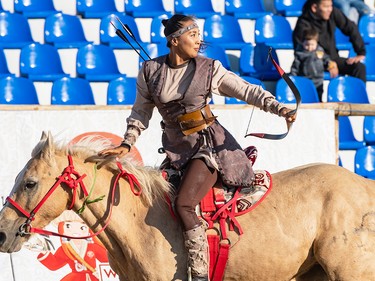 A Mongolian horseback archer reacts after her final arrow hits the target the 2024 World Nomad Games in Kazakhstan,