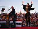 Elon Musk, right, and Donald Trump address a campaign rally in Butler, Pa., on Oct. 5.