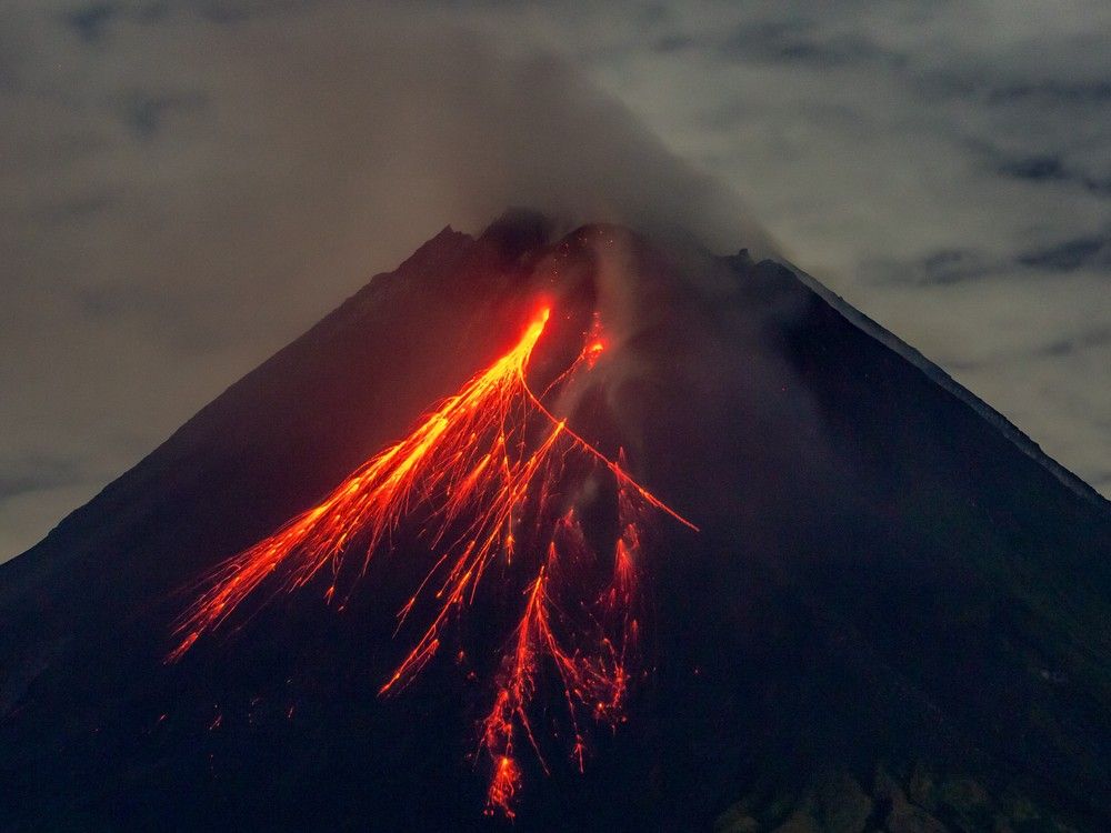 NextImg:Indonesian rescuers dig through volcanic ash after eruption kills 9