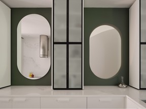 The kitchen receives no direct light, but pill-shaped openings — one is a mirror — brighten things up.