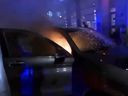 A car is shown on fire during the protest in Montreal on Nov. 22, 2024.