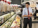 Prime Minister Justin Trudeau visits Vince's Market, a grocery store in Sharon, Ontario, on Thursday November 21, 2024. The government announced a promise for a $250 tax rebate for eligible Canadians.