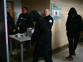 Co-defendants walk through the security portal