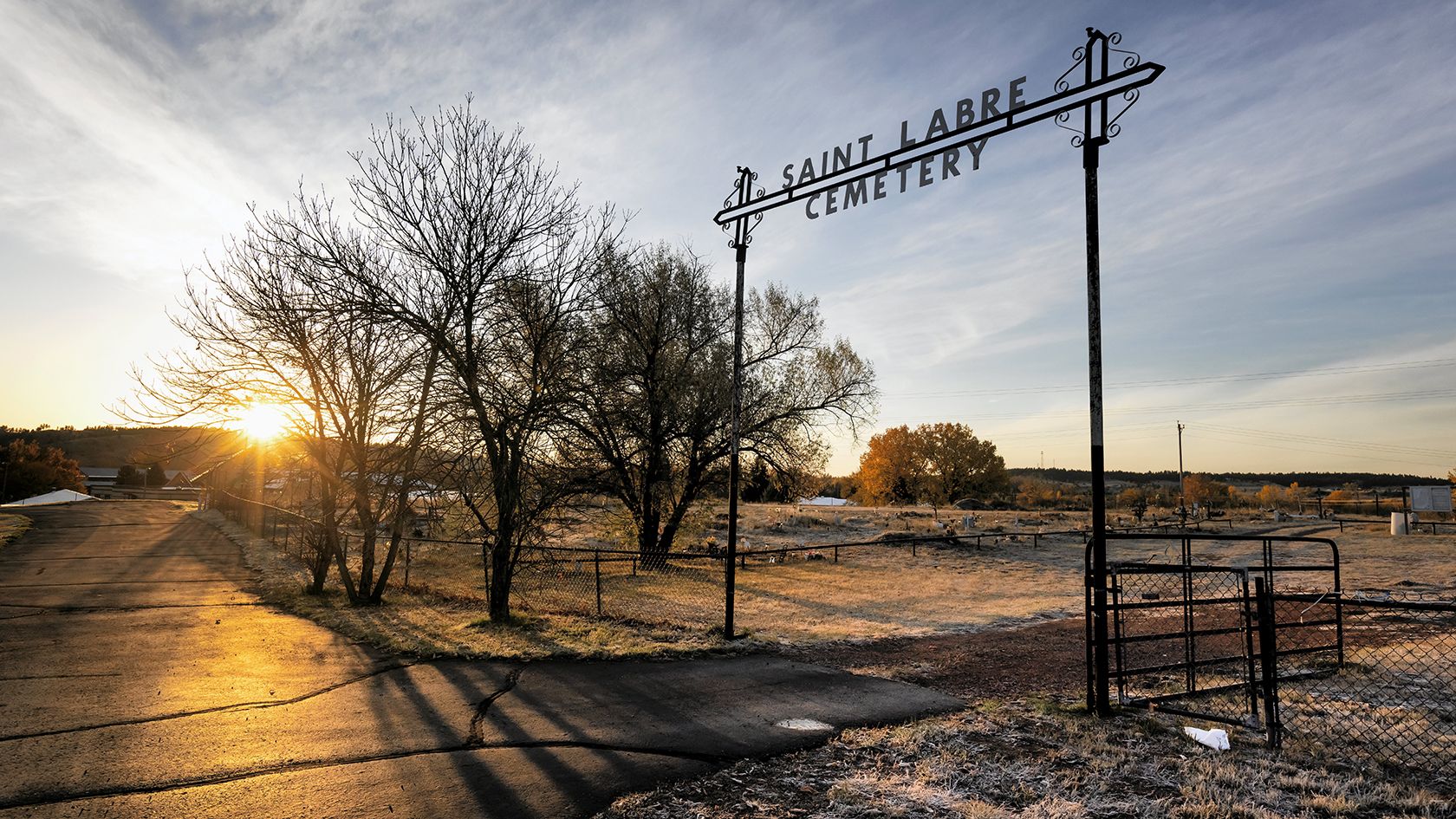 The sun rises at the St. Labre Cemetery outside the St. Labre Indian School in Montana, Tuesday October 22, 2024.