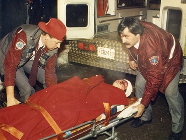 First responders take a victim from École Polytechnique after the Dec. 6, 1989, rampage that killed 14 women.