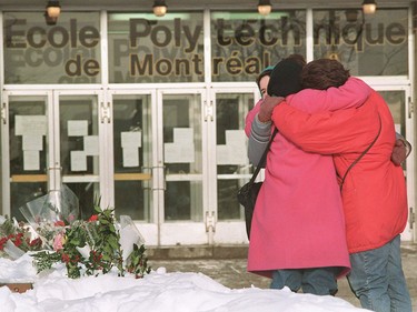 Three women comfort each other after laying flowers in front of the University of Montreal’s École Polytechnique on Dec. 9, 1989.