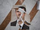 A torn portrait of Bashar Assad, that appears to have been arranged, is seen inside the Presidential Palace on December 10, 2024 in Damascus, Syria. (Photo by Ali Haj Suleiman/Getty Images)