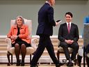 Prime Minister Justin Trudeau, right, and Gov. Gen. Mary Simon, left, look on as Liberal MP Terry Duguid takes part in a cabinet swearing-in ceremony at Rideau Hall in Ottawa on Friday, Dec 20, 2024.
