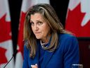 Minister of Finance and Deputy Prime Minister Chrystia Freeland listens to a question from a reporter (not seen) during a press conference at the National Press Theatre in Ottawa on December 3, 2024.