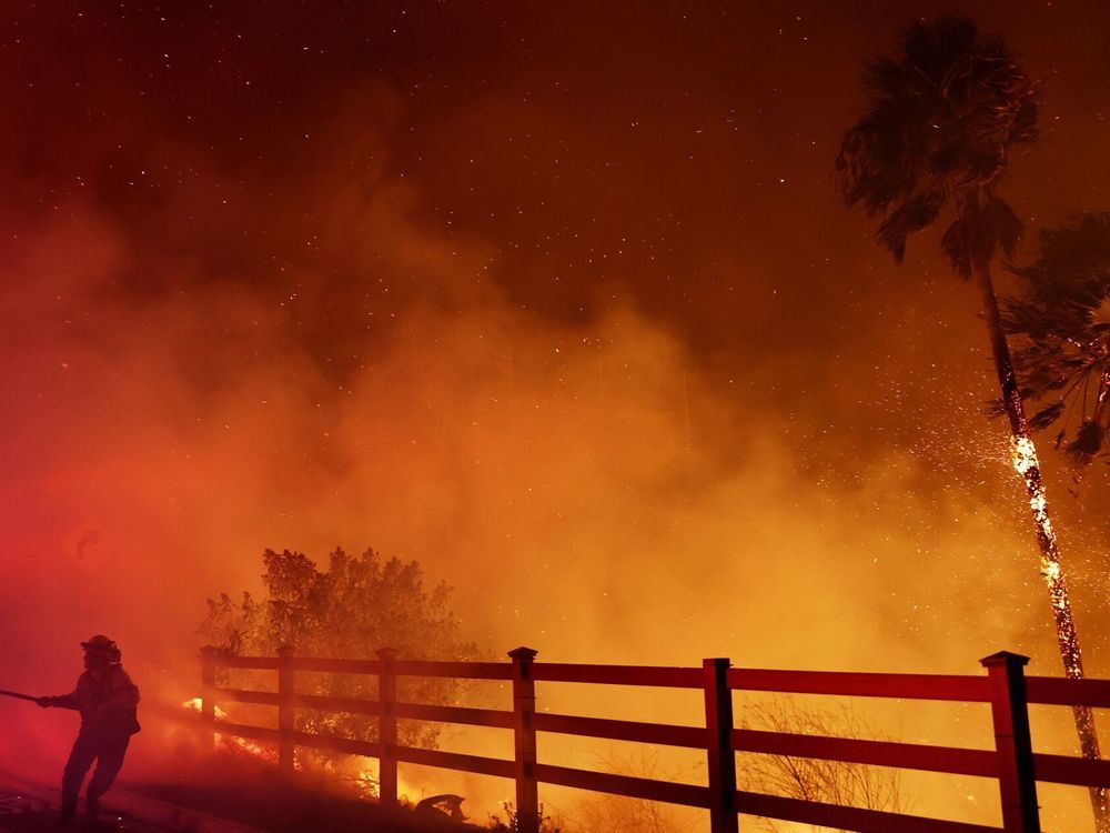 NextImg:Massive Los Angeles-area wildfire forces schools to shut