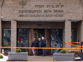 Police tape around a firebombed Montreal synagogue.