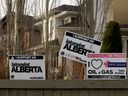 Signs supporting Alberta independence are seen in Edmonton in 2021.