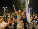 People cheer as the hostages arrive at Sheba Medical Center, also known as Tel HaShomer Hospital, where hostages are arriving after the first phase of a ceasefire agreement began between Israel and Hamas on Jan. 19, 2025 in Ramat Gan, Israel.