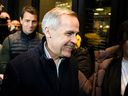 Mark Carney, candidate for the leadership of the federal Liberal party, leaves after participating in a scrum with journalists on the sidewalk outside the venue of his campaign event in Ottawa, Thursday, Jan. 23, 2025.