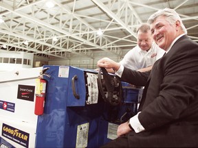 Jimmy MacNeil in 2001 with Pat Quinn — then head coach and GM of the Toronto Maple Leafs — at the wheel of the Zamboni MacNeil was tapped to drive across Canada.