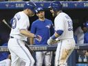 Toronto Blue Jays catchers Russell Martin (right) and Josh Donaldson were in Toronto on July 6, 2017.