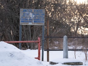 A sign on snowy ground.