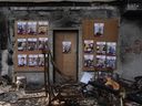 Photographs of Israeli hostages taken by Hamas terrorists on a house destroyed by Hamas in Kibbutz Be'eri, Israel, on Dec. 20, 2023.