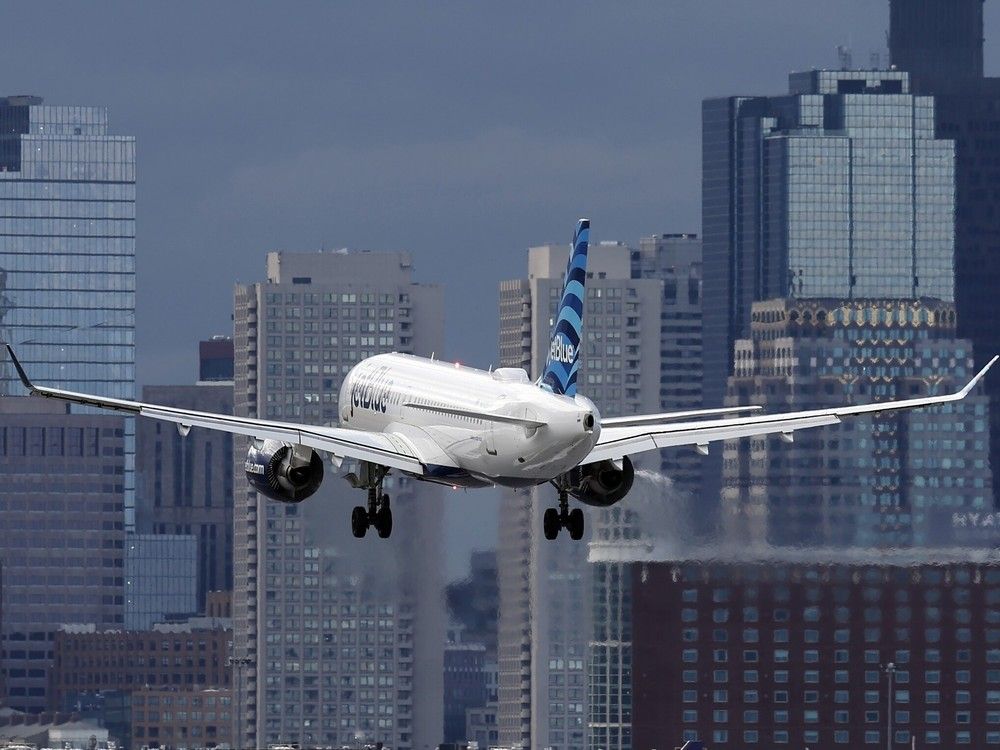 NextImg:Boston JetBlue passenger opens emergency exit after alleged argument with girlfriend
