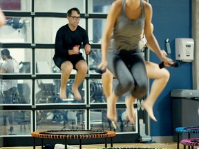 Timothy Caulfield on a trampoline at a gym.