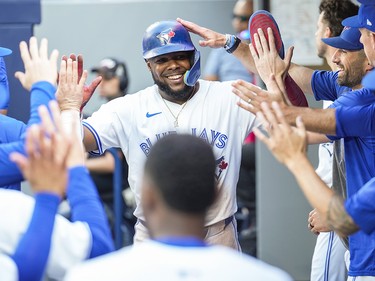 Vladimir Guerrero Jr. of the Toronto Blue Jays celebrates with teammates his run against the St. Louis Cardinals at the Rogers Centre on September 14, 2024, in Toronto.