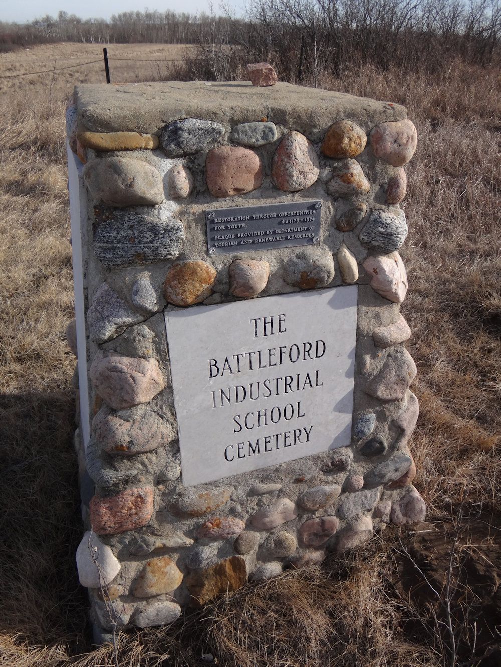  a marker that now stands on the battleford industrial school cemetery, where at least 74 children are buried.