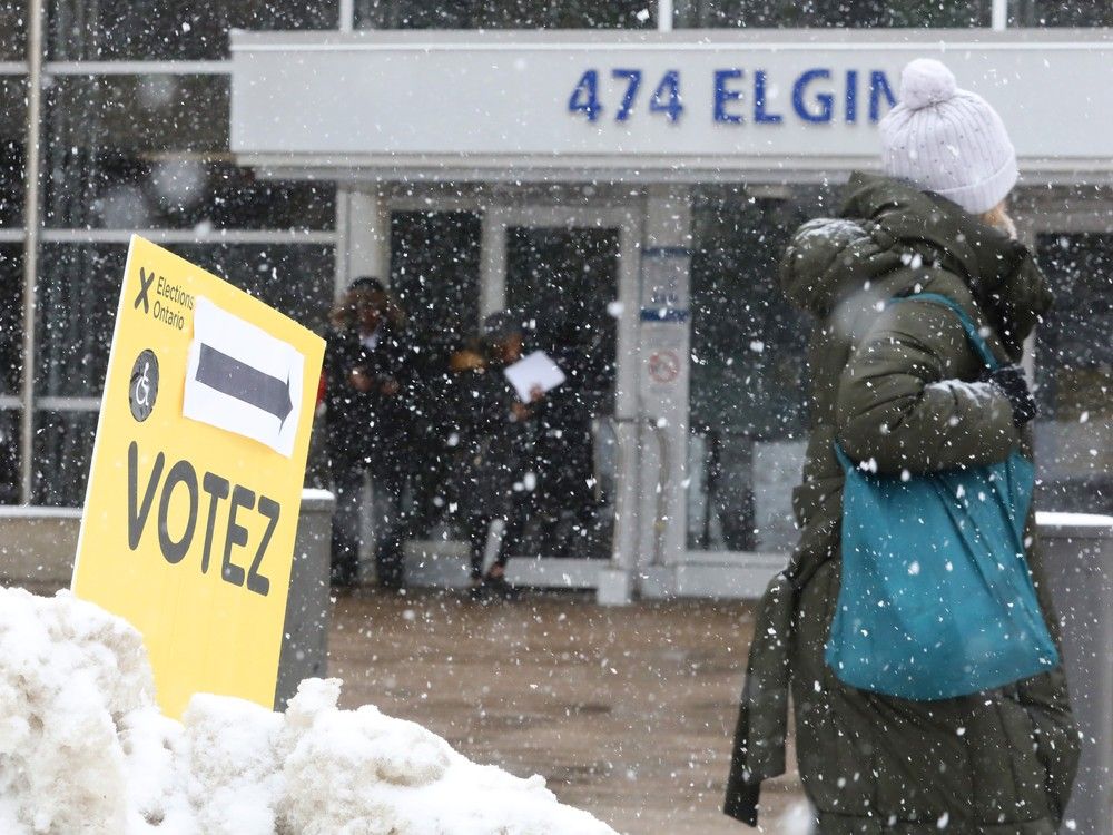  Voters enter and leave a polling station in Ottawa on election day.