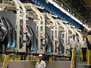 Workers continue vehicle assembly at the Honda of Canada Manufacturing Plant 2 in Alliston, Ontario, on April 25, 2024.