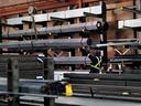 A worker moves steel product at North York Iron, a steel supplier in Toronto, Ontario, Canada, Tuesday, February 11, 2025.