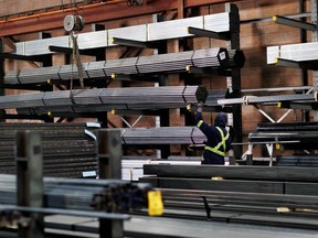 A worker moves steel product at North York Iron, a steel supplier in Toronto, Ontario, Canada, Tuesday, February 11, 2025.