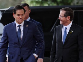 U.S. Secretary of State Marco Rubio, left, is welcomed by Israel's President Isaac Herzog