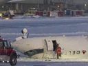 A Delta airlines plane sits on its roof after crashing upon landing at Toronto Pearson Airport in Toronto, Ontario, on Feb. 17, 2025.
